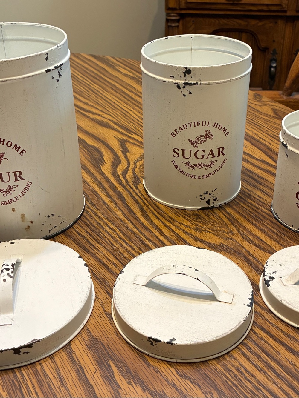 white metal canister set features a distressed farmhouse design "Beautiful Home - Picture 5 of 7